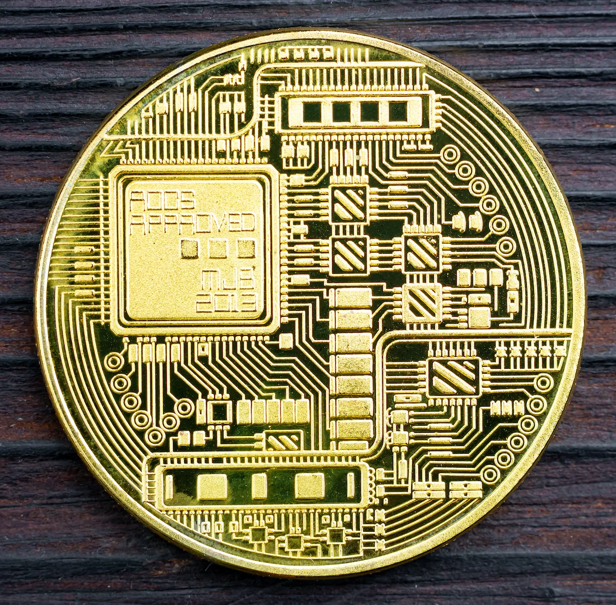 Gold coin with digital patterns